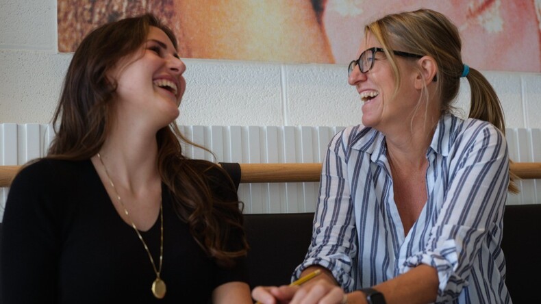 Influent Student and Teacher Laughing