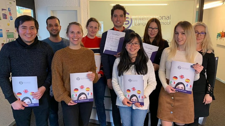 Students celebrating receiving their certificate