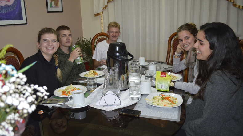 Enjoying a meal with host family